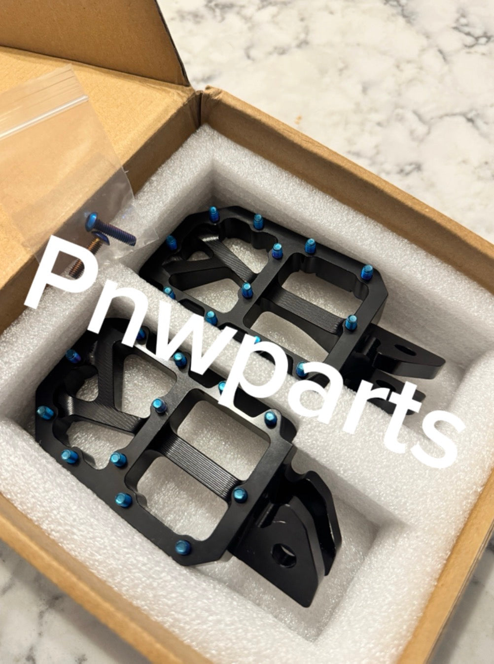 Emoto foot pegs (come with burnt blue pins)