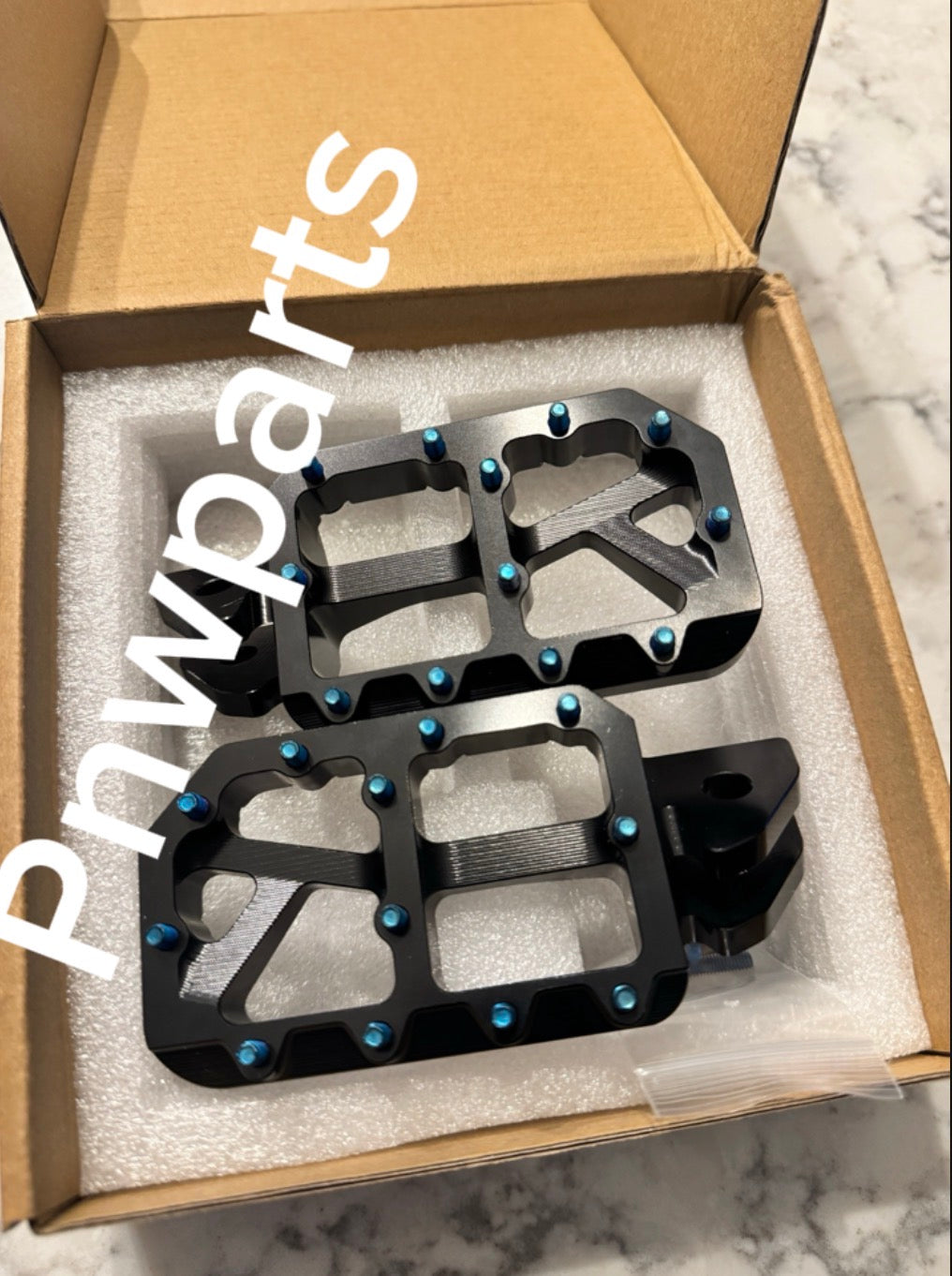 Emoto foot pegs (come with burnt blue pins)